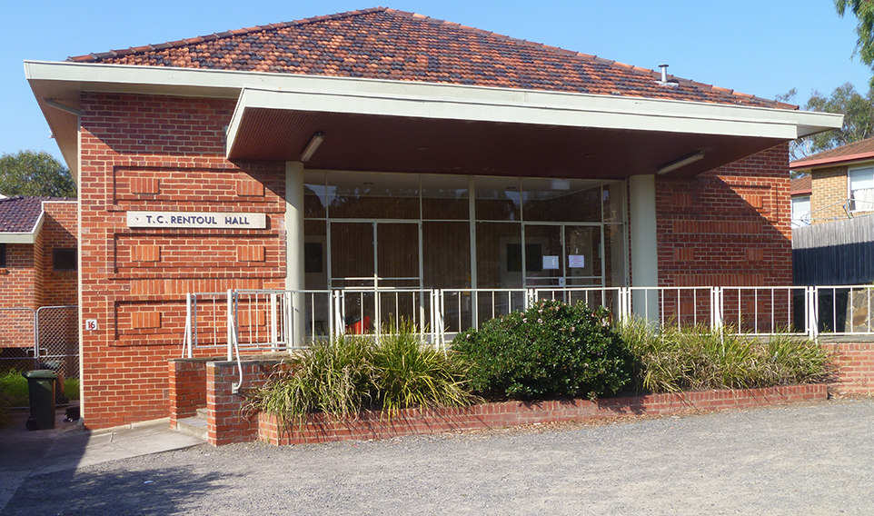 An exterior photo of a red brick building 