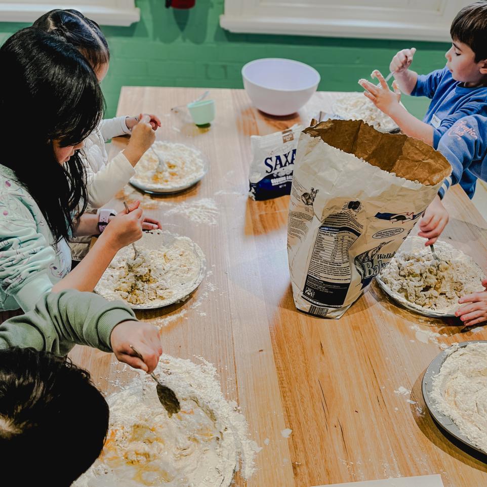 children stiring mixture in kids cooking class at Strathdon House