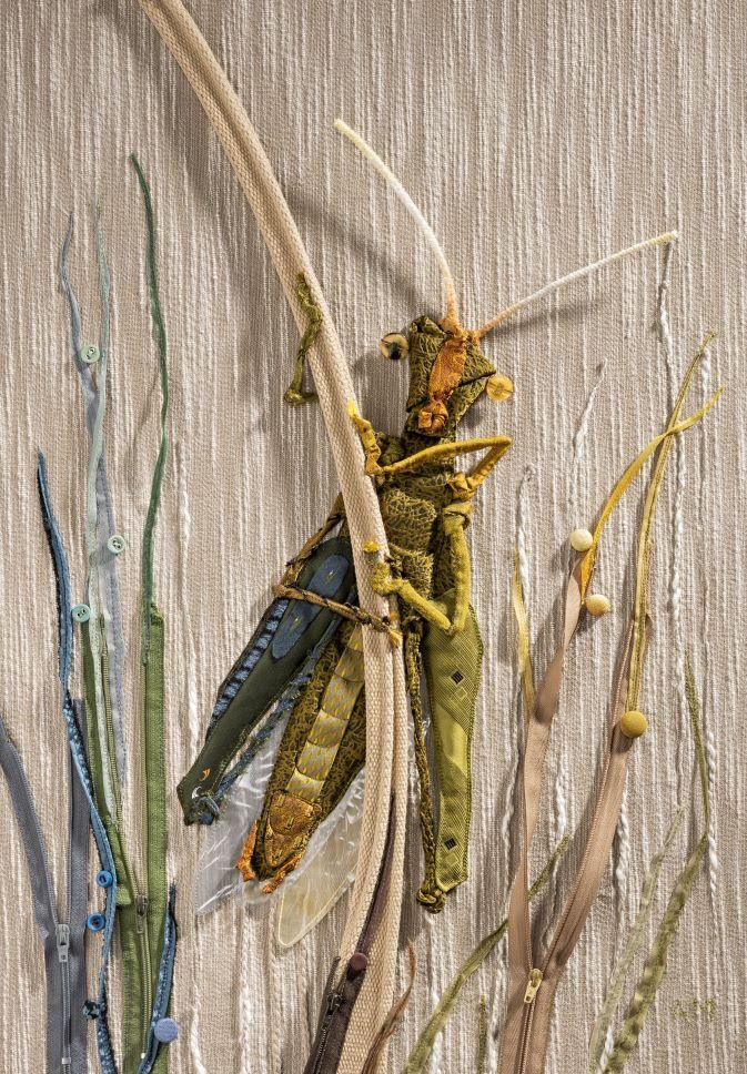 Grasshopper made from a man's tie and zippers