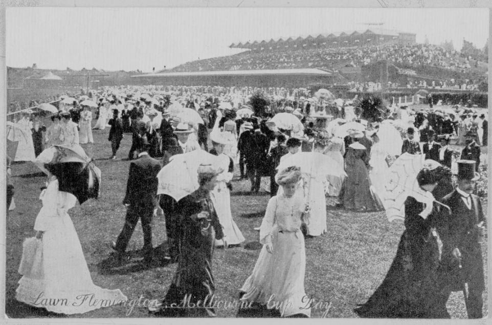 Black and white photo of ladies on the lawn at Flemington wearing 19th century dresses