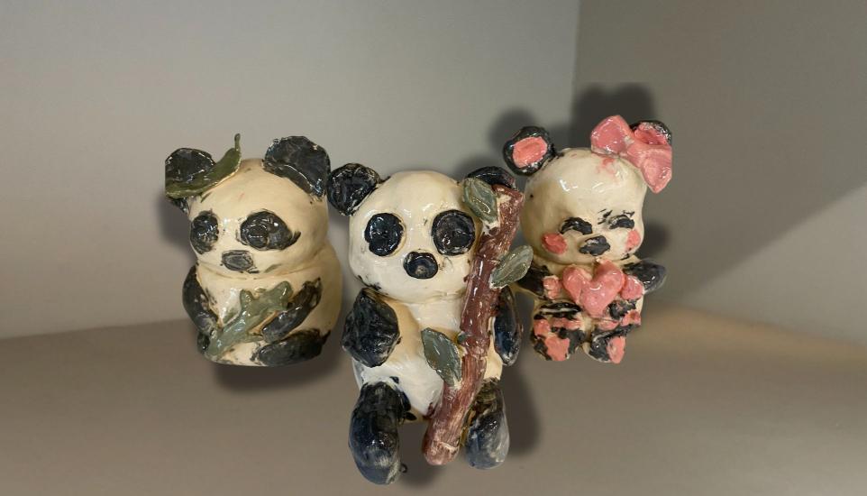 three ceramic pandas 