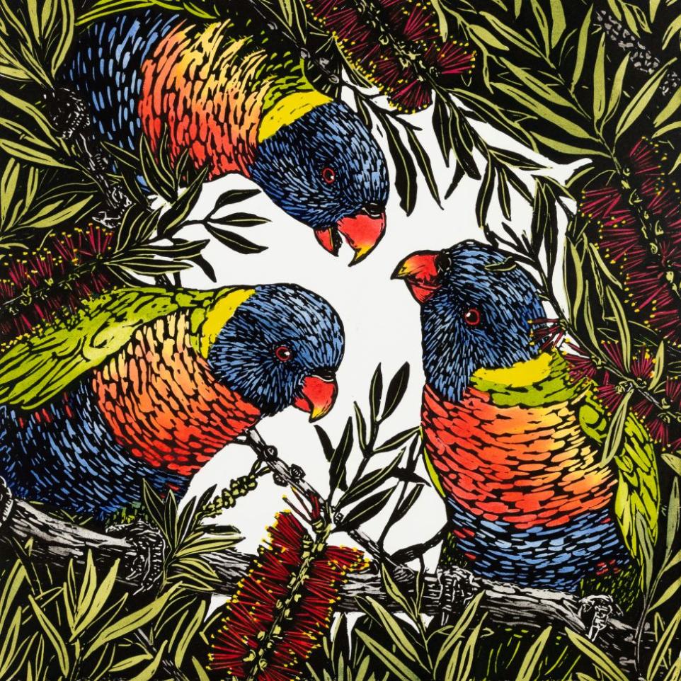 Three brightly coloured parrots in foliage cluster in a circle and look at the viewer.