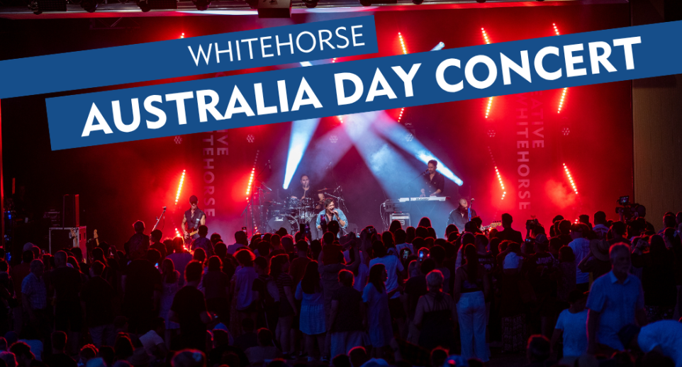 large crowd of people in front of concert stage