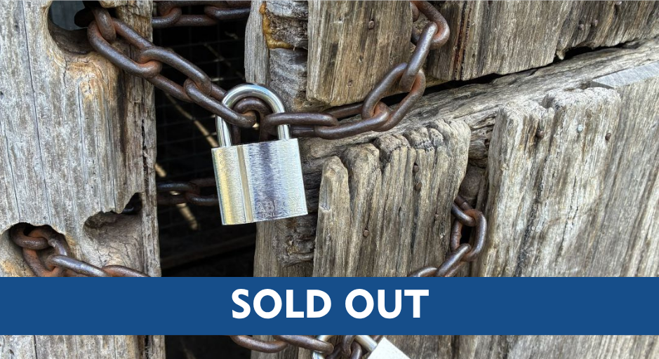 Padlock and chain with 'sold out' sign.