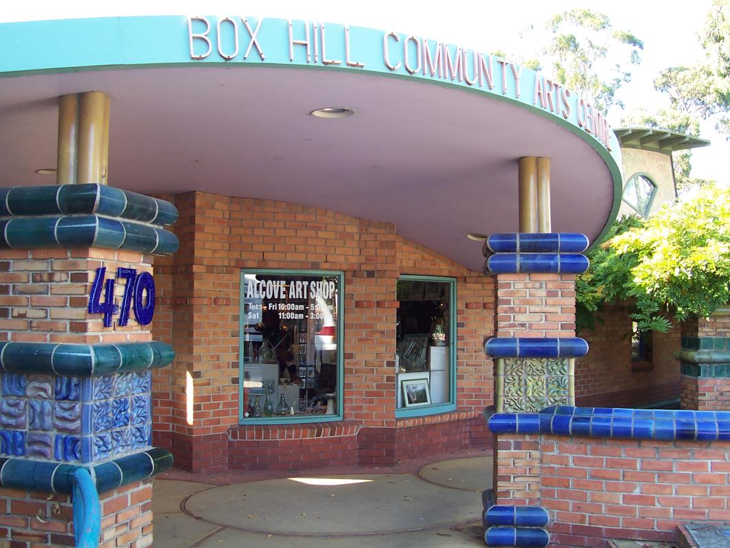 Entrance to BHCAC with 470 on pillar and Alcove Art Shop on front window