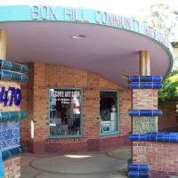 Entrance to BHCAC with 470 on pillar and Alcove Art Shop on front window