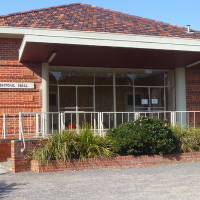 An exterior photo of a red brick building 