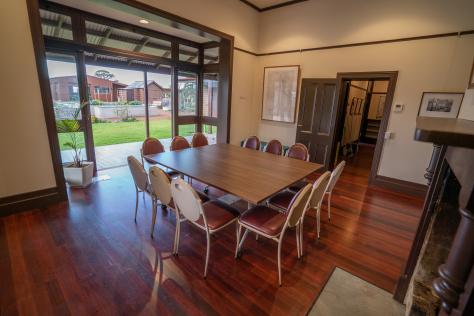 Meeting room with a square table in the centre with chairs around it