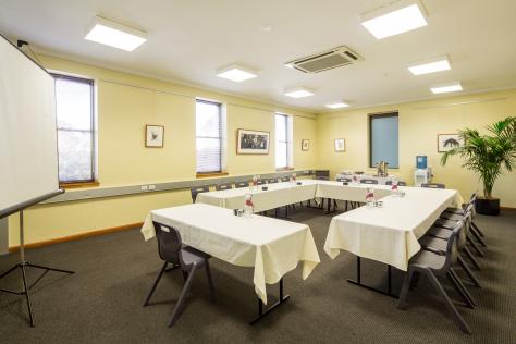 The Box Hill Town Hall's Visual Arts Room set up with chairs and tables in a U shape