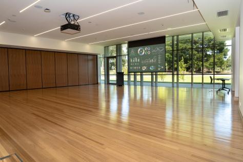 The Nunawading Community Hub's Studio 2 with projector screen down and lectern