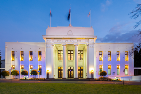The Box Hill Town hall exterior lit with blue lighting
