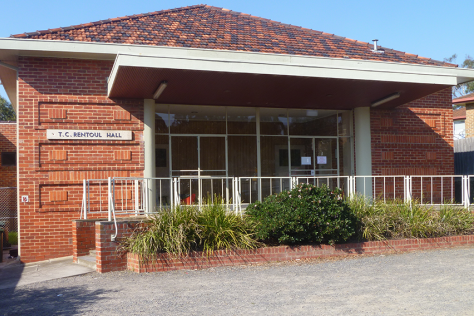 An exterior photo of a red brick building 