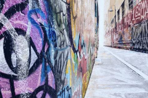 Artist rendering of a street lane with graffiti.