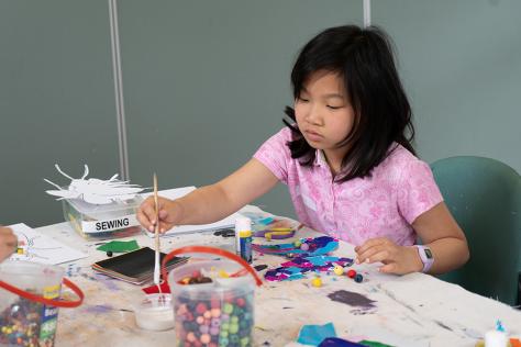 young girl painting in art studio