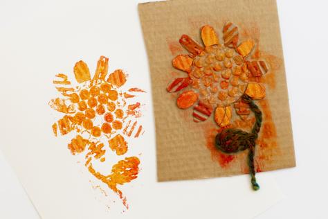 an orange flower printed on cardboard.