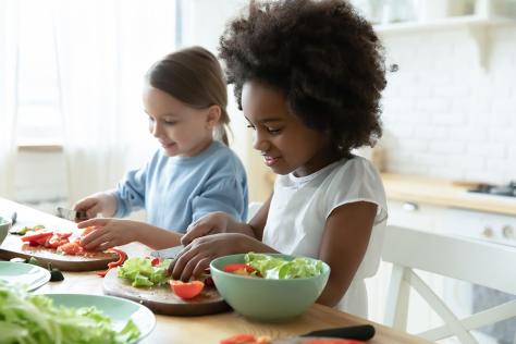 Children in kids cooking workshop in the kitchen at Strathdon House 