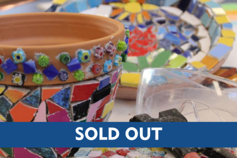 terracotta pot with brightly coloured titles on the outside with a sold out banner across the image