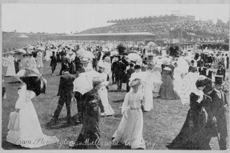 Black and white photo of ladies on the lawn at Flemington wearing 19th century dresses