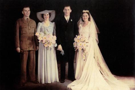 Photograph of a wedding party 1942, hand coloured.