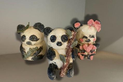 three ceramic pandas 
