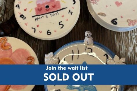 ceramic clocks with sold out overlay text