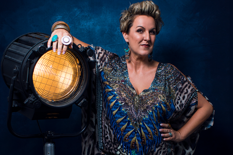 Queenie Van De Zandt leans on a great big light! She's looking pretty cool too. 