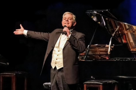 Tenor Roy Best singing on stage