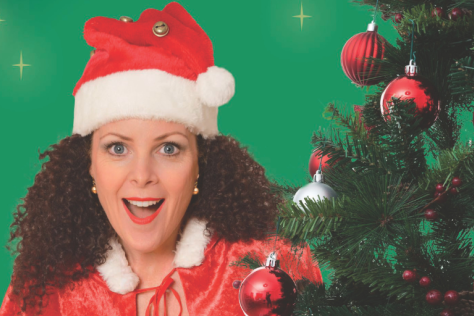 Gina Hogan posing with christmas tree