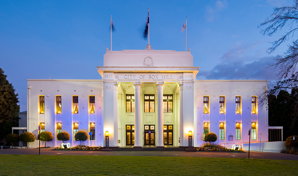 The Box Hill Town hall exterior lit with blue lighting