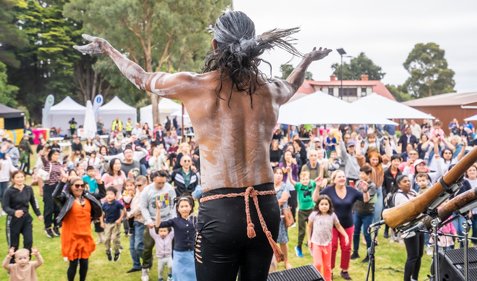 A man dancing on stage for the audience 