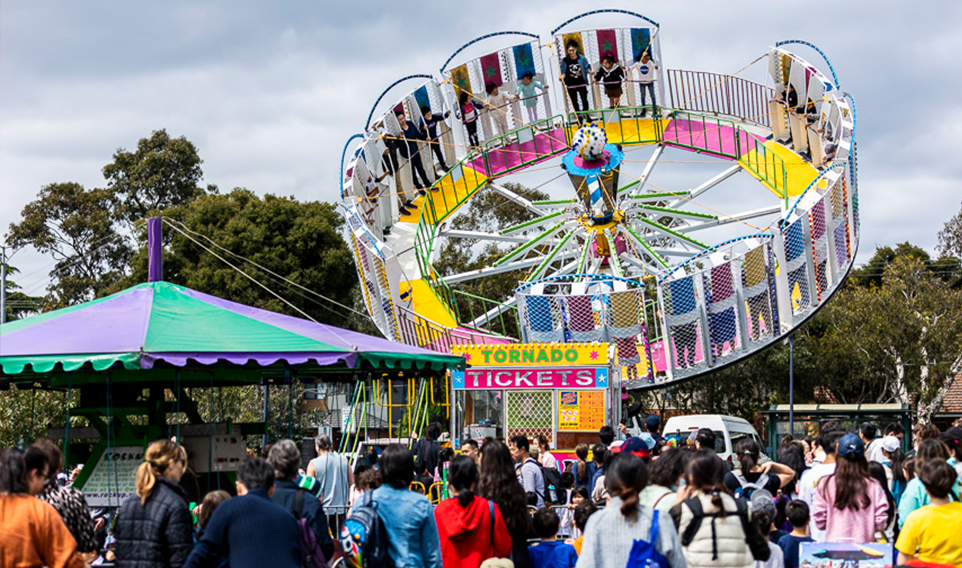 Wide shot of carnival ride at a festival 